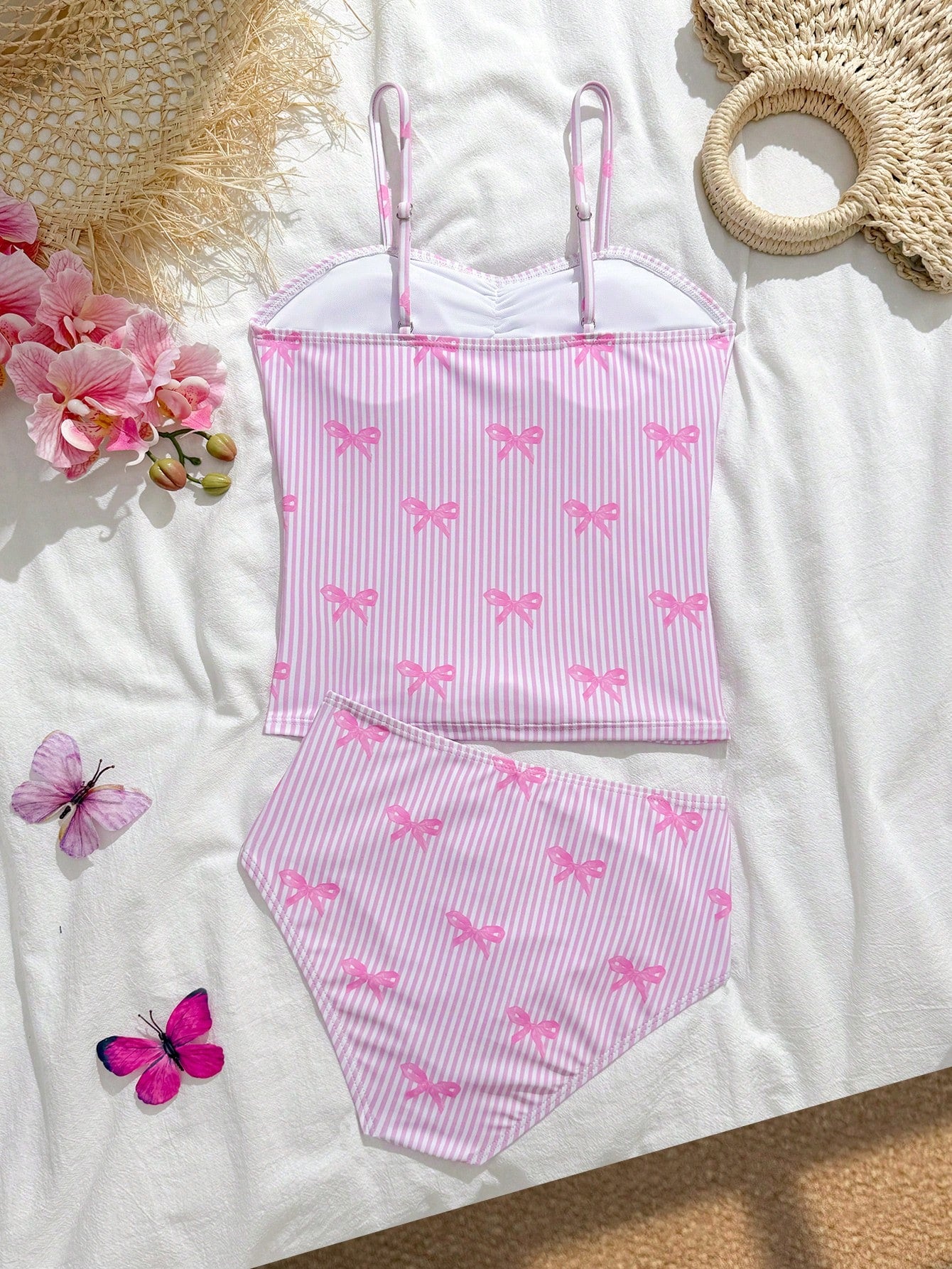 Tween girls 2-piece bikini swimwear set in black with a wave-pattern geometric design, featuring halter neckline, wireless top, and high-waist short bottoms with starfish and shell decor.