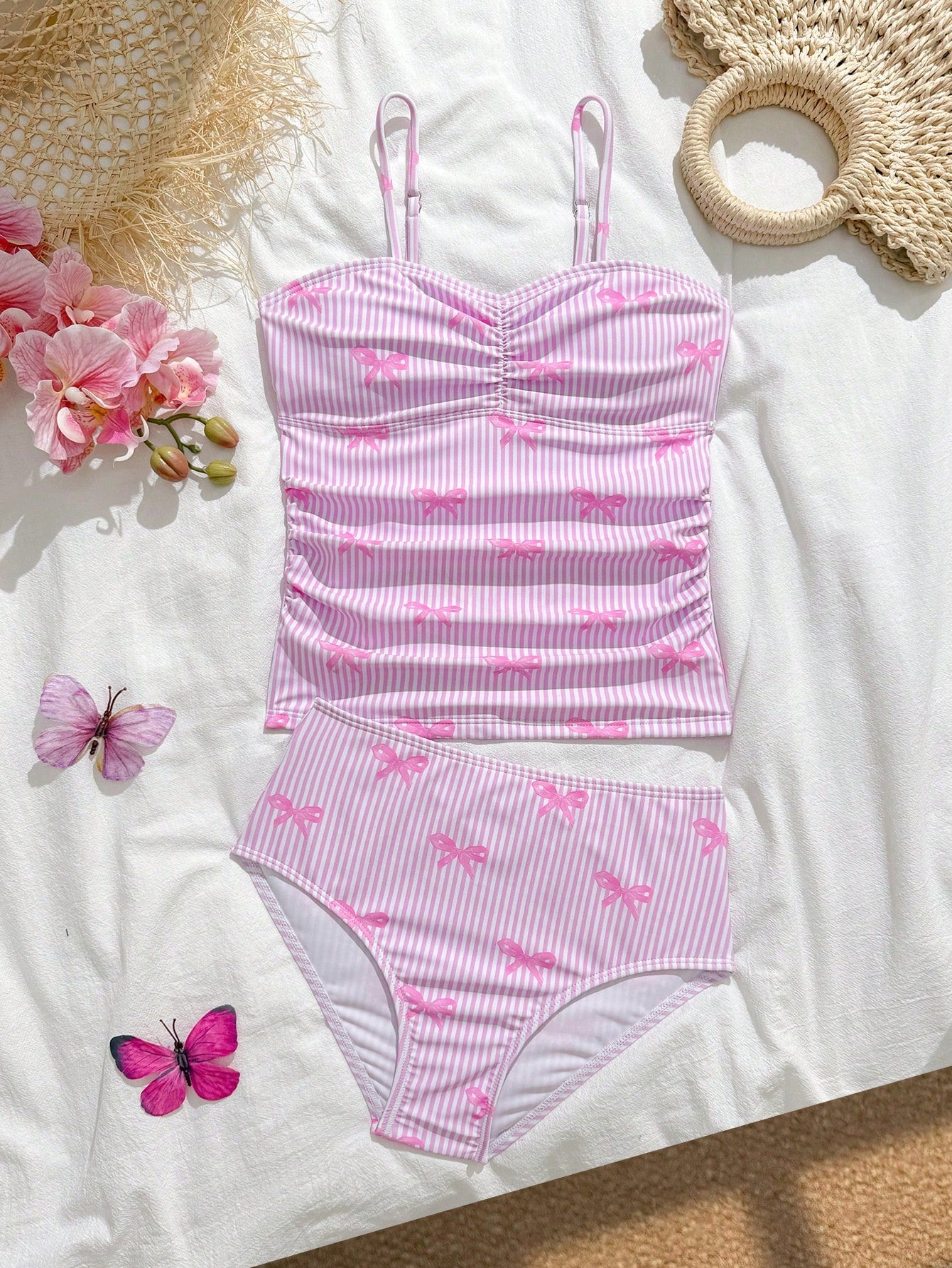 Tween girls 2-piece bikini swimwear set in black with a wave-pattern geometric design, featuring halter neckline, wireless top, and high-waist short bottoms with starfish and shell decor.