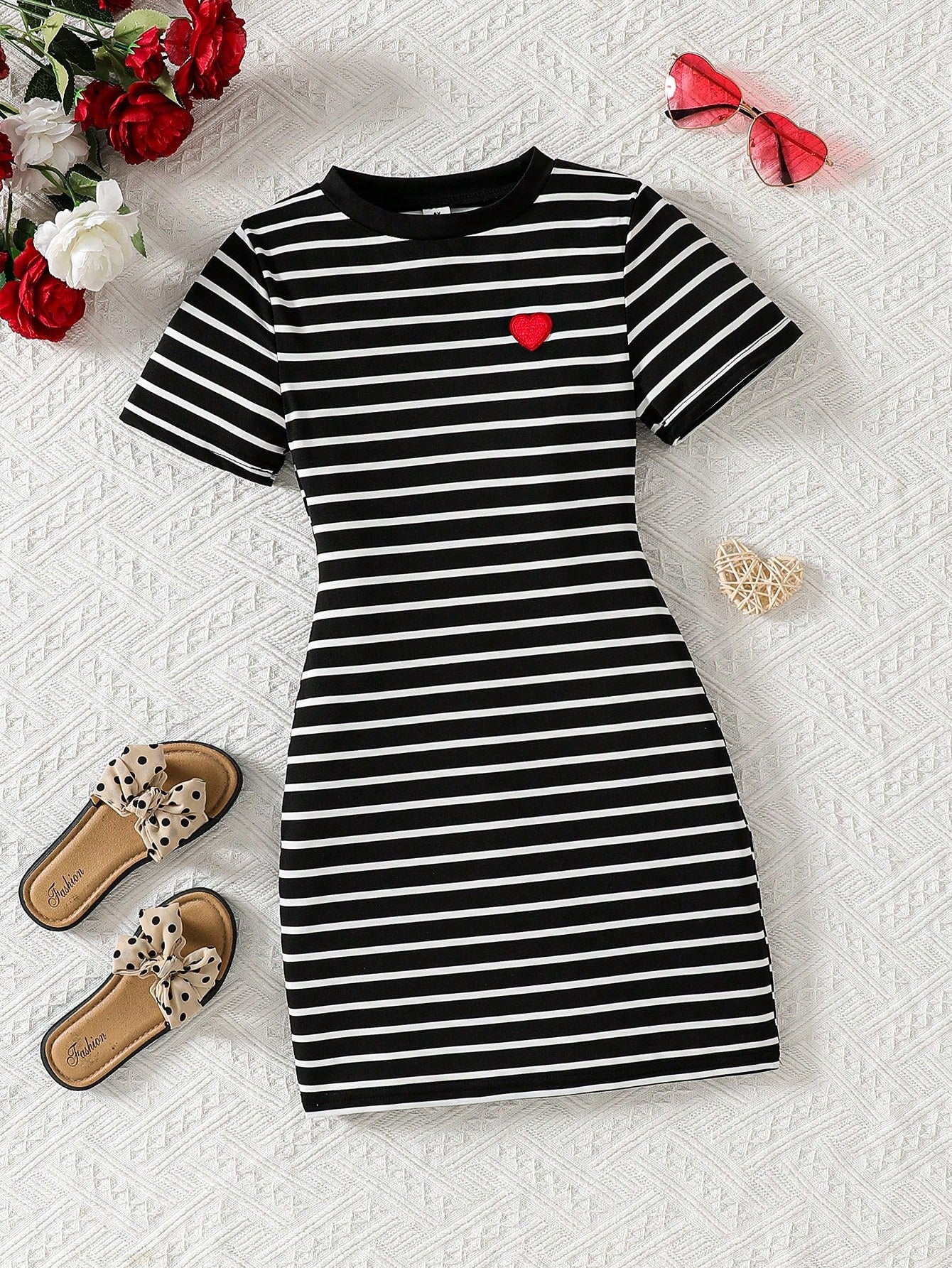Girls black striped midi dress featuring short sleeves, round neck, slim fit, and flared hem.
