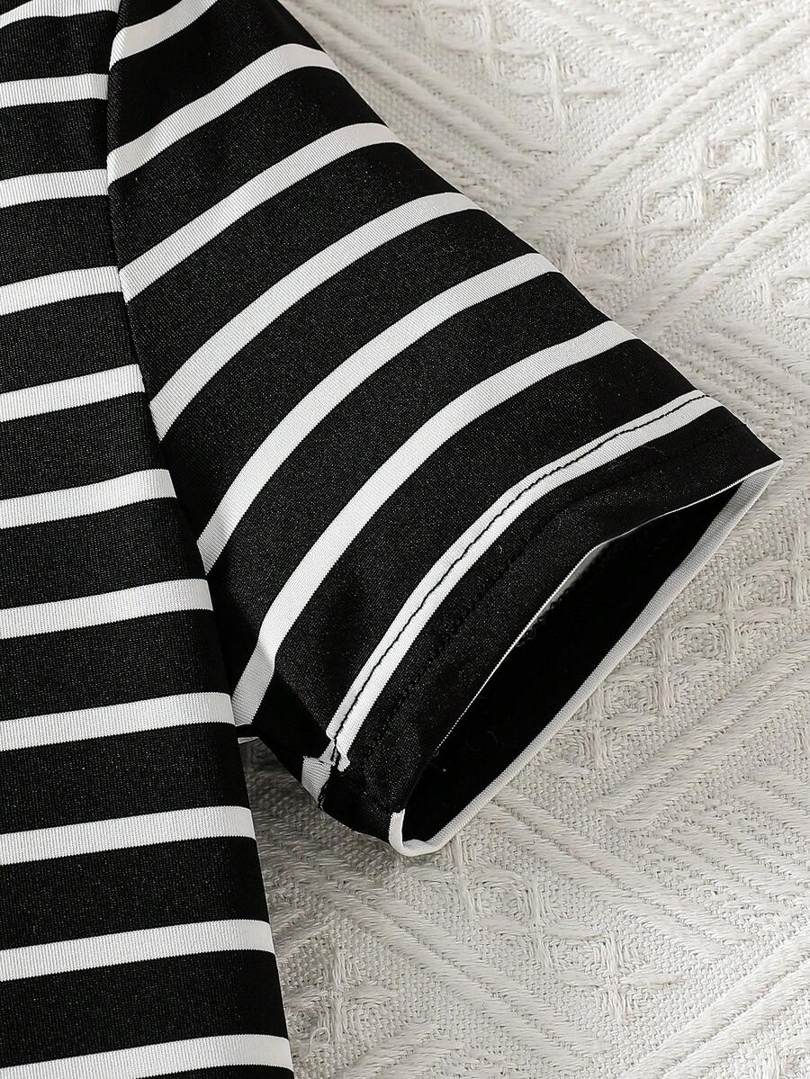 Girls black striped midi dress featuring short sleeves, round neck, slim fit, and flared hem.