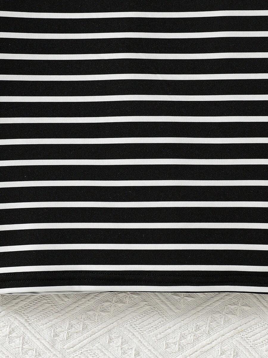 Girls black striped midi dress featuring short sleeves, round neck, slim fit, and flared hem.