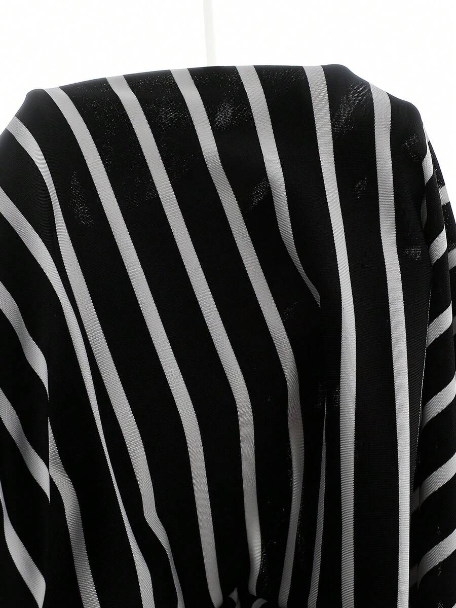 Girls black striped midi dress featuring short sleeves, round neck, slim fit, and flared hem.