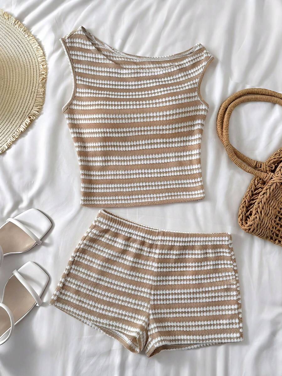 Tween girls 2-piece summer clothing set featuring a black asymmetric rib-knit striped off-shoulder t-shirt and matching slim fit shorts.