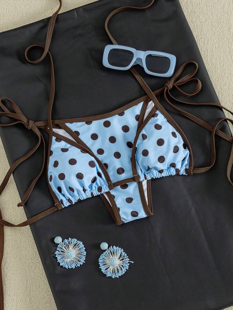 Women's two-piece halter triangle bikini set featuring a backless tie-back top with removable padding and matching tie-side mid-waist bottoms.