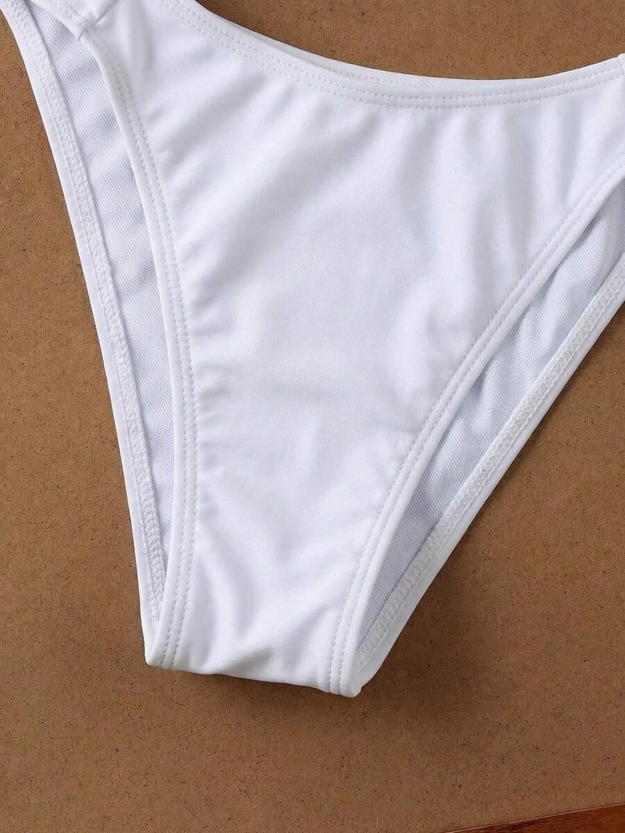 Women's halter neck bikini swimwear set featuring a wireless bra top with removable padding and mid waist bikini bottom.