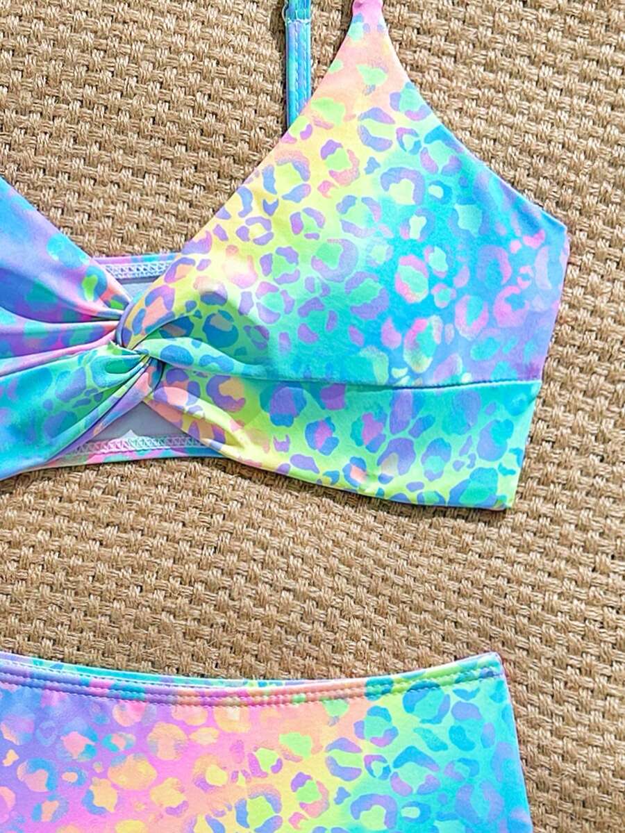 Tween girls multicolor striped 2-piece bikini set with spaghetti strap top, twist detail, and short high-waist or mid-waist swim bottoms for beach and pool wear.