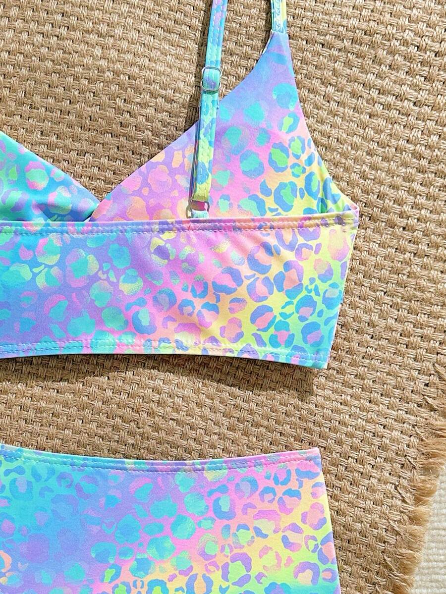 Tween girls multicolor striped 2-piece bikini set with spaghetti strap top, twist detail, and short high-waist or mid-waist swim bottoms for beach and pool wear.