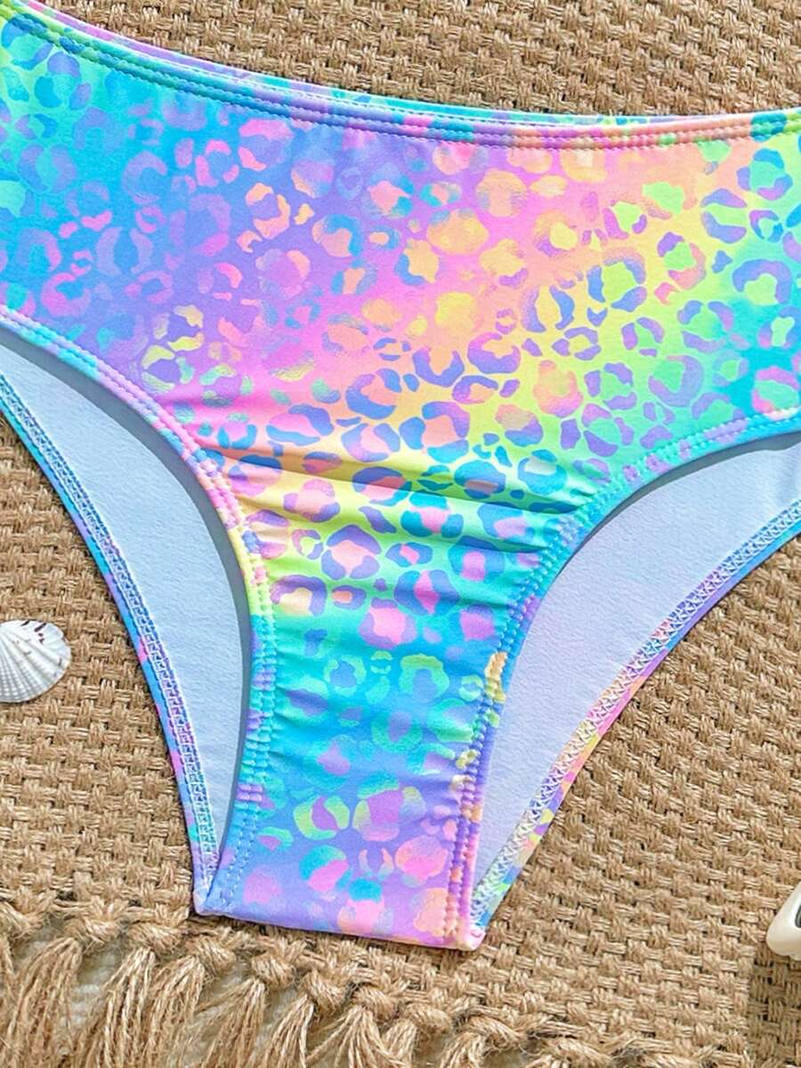 Tween girls multicolor striped 2-piece bikini set with spaghetti strap top, twist detail, and short high-waist or mid-waist swim bottoms for beach and pool wear.
