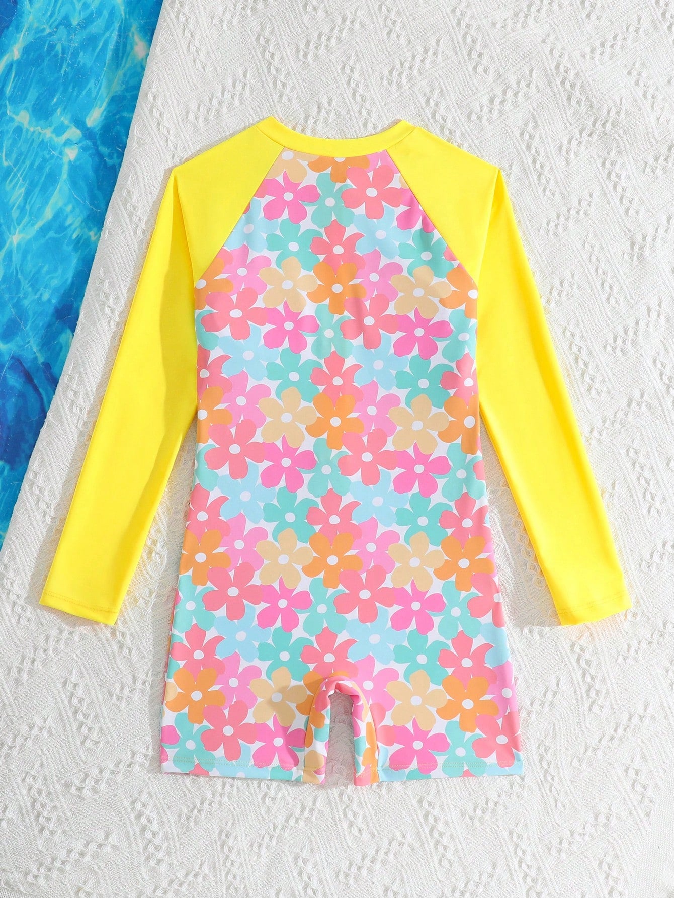 Tween girls one-piece swimsuit featuring a high neck, long sleeves, and shorts bottom, with a back zipper and strawberry plaid digital print on stretch knit fabric. Designed for swimming, vacation, and summer wear.