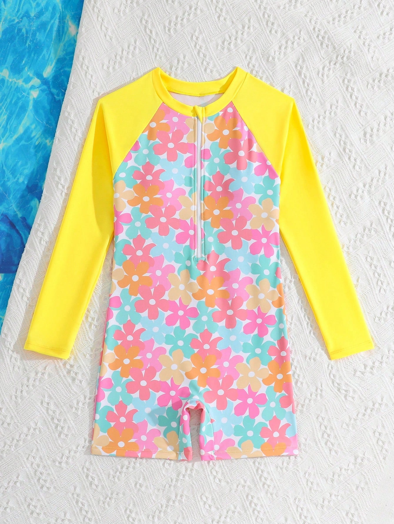 Tween girls one-piece swimsuit featuring a high neck, long sleeves, and shorts bottom, with a back zipper and strawberry plaid digital print on stretch knit fabric. Designed for swimming, vacation, and summer wear.