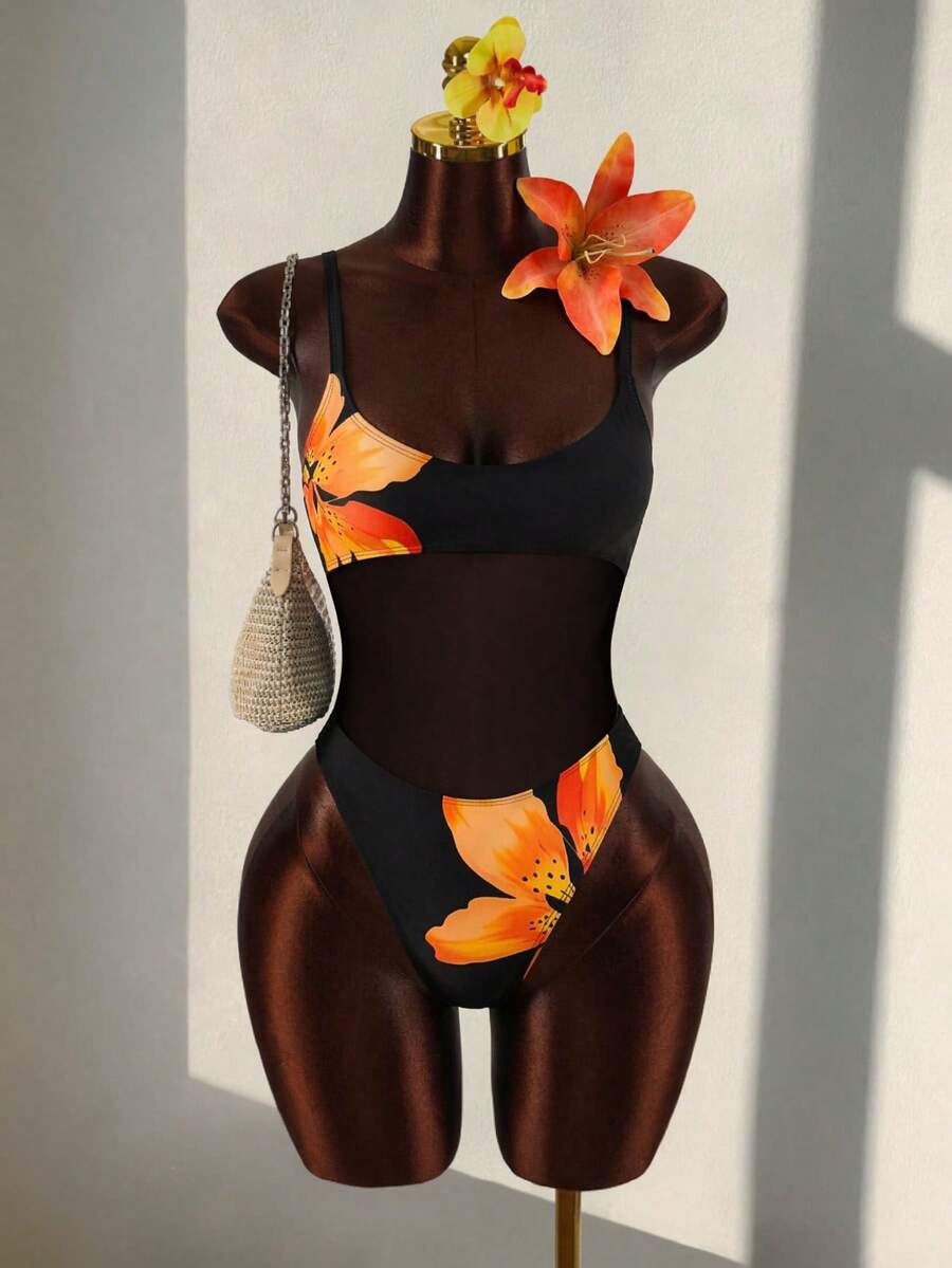 Black floral print mesh patchwork one-piece swimsuit for women featuring spaghetti straps, V-wired triangle cups, and a high waist silhouette.