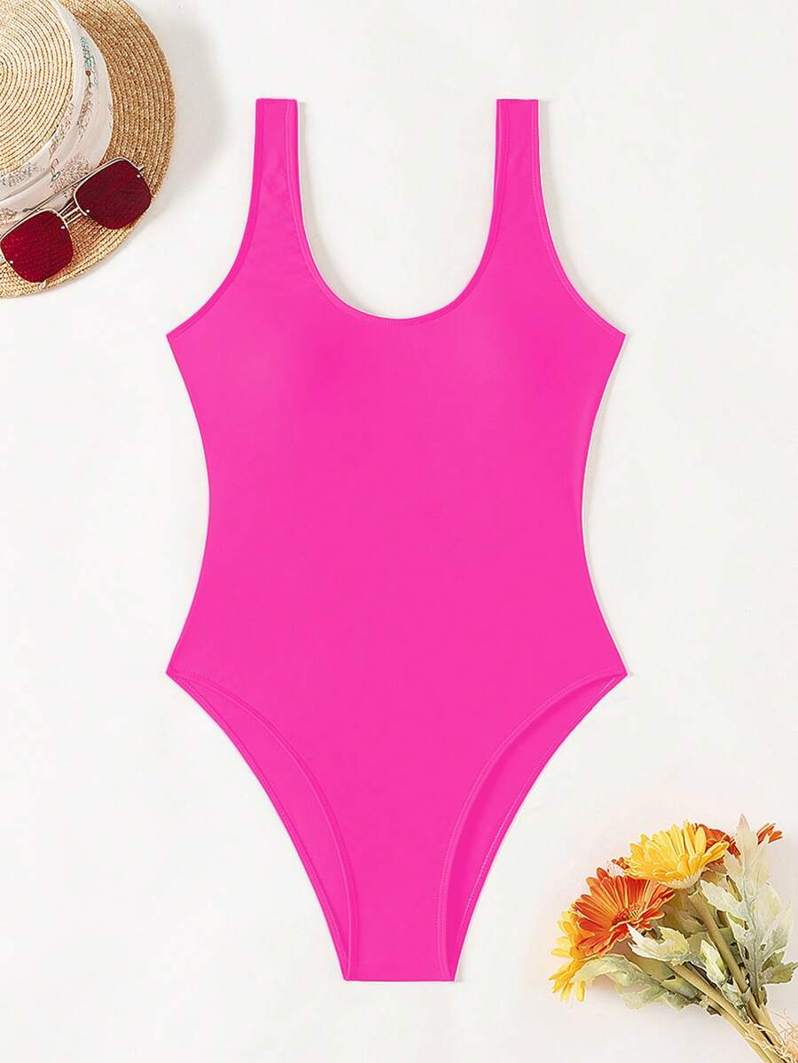 Women's solid color one-piece swimsuit featuring a backless scoop neck design and high cut fit