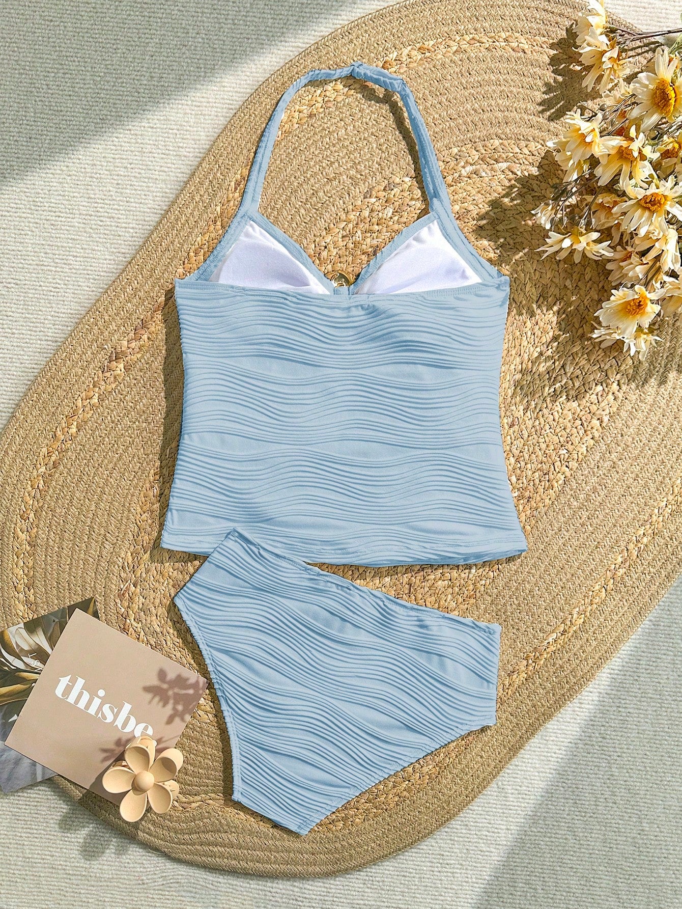 Tween girls 2-piece bikini swimwear set in black with a wave-pattern geometric design, featuring halter neckline, wireless top, and high-waist short bottoms with starfish and shell decor.