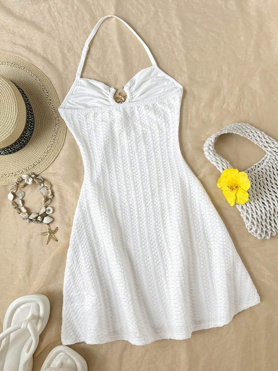 Apricot tween girls sleeveless halter cami dress with appliques, bow front, zipper detail, high waist, flared hem, and short slim fit design.