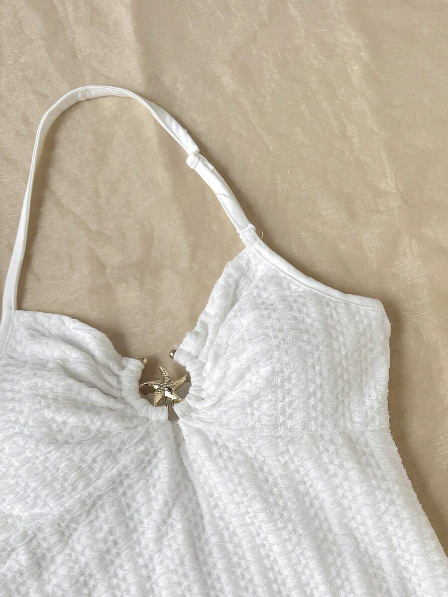 Apricot tween girls sleeveless halter cami dress with appliques, bow front, zipper detail, high waist, flared hem, and short slim fit design.