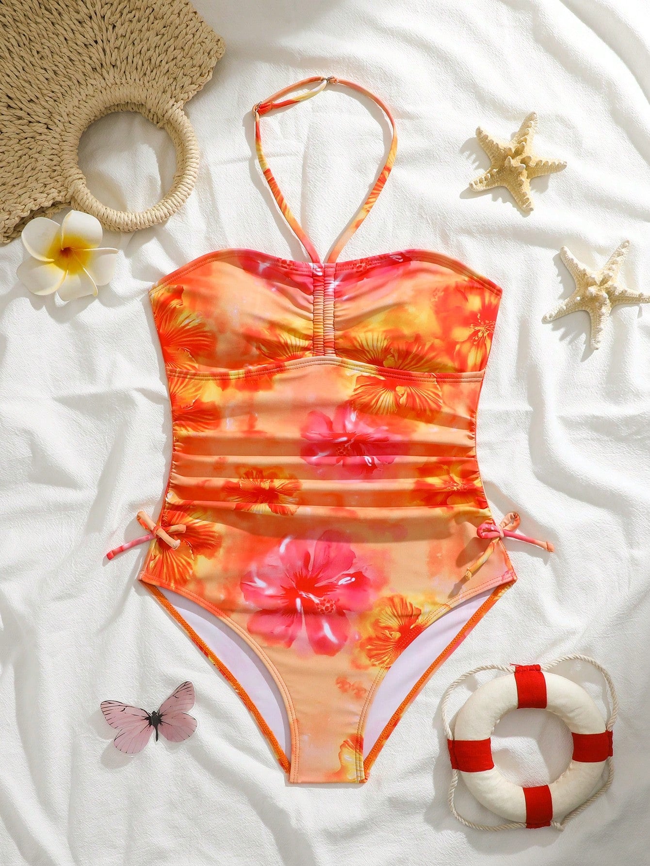 Blue halter one-piece swimsuit for tween girls with full geometric print, wireless bra design, mid-waist bottom, and medium-stretch fabric for beach and pool wear.