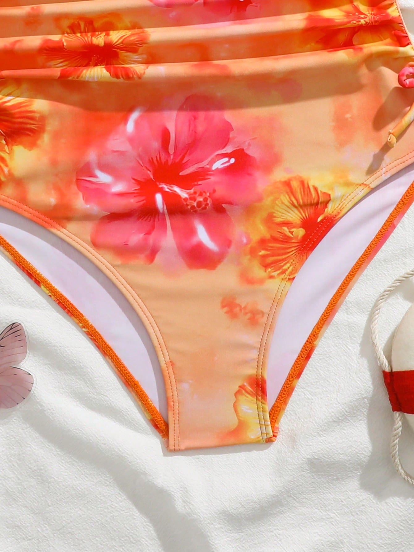 Blue halter one-piece swimsuit for tween girls with full geometric print, wireless bra design, mid-waist bottom, and medium-stretch fabric for beach and pool wear.