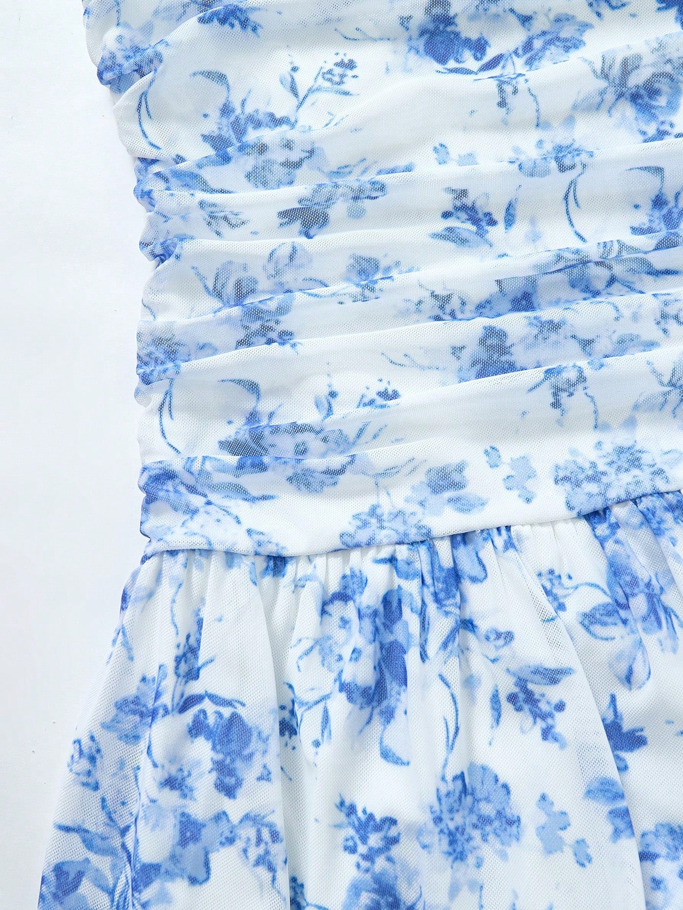 Blue floral strapless tube dress for tween girls with ruched bust, shirred detail, zipper closure, high waist, flared hem, and slim fit.