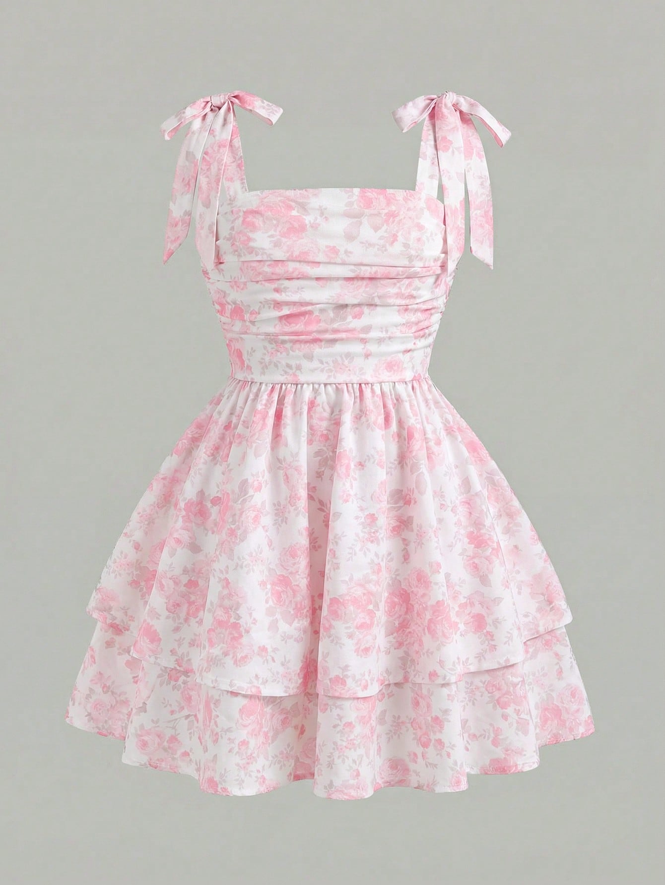 Black and white polka dot cami dress for tween girls featuring sleeveless straps, a shirred high waist, flared hem, and slim fit silhouette.