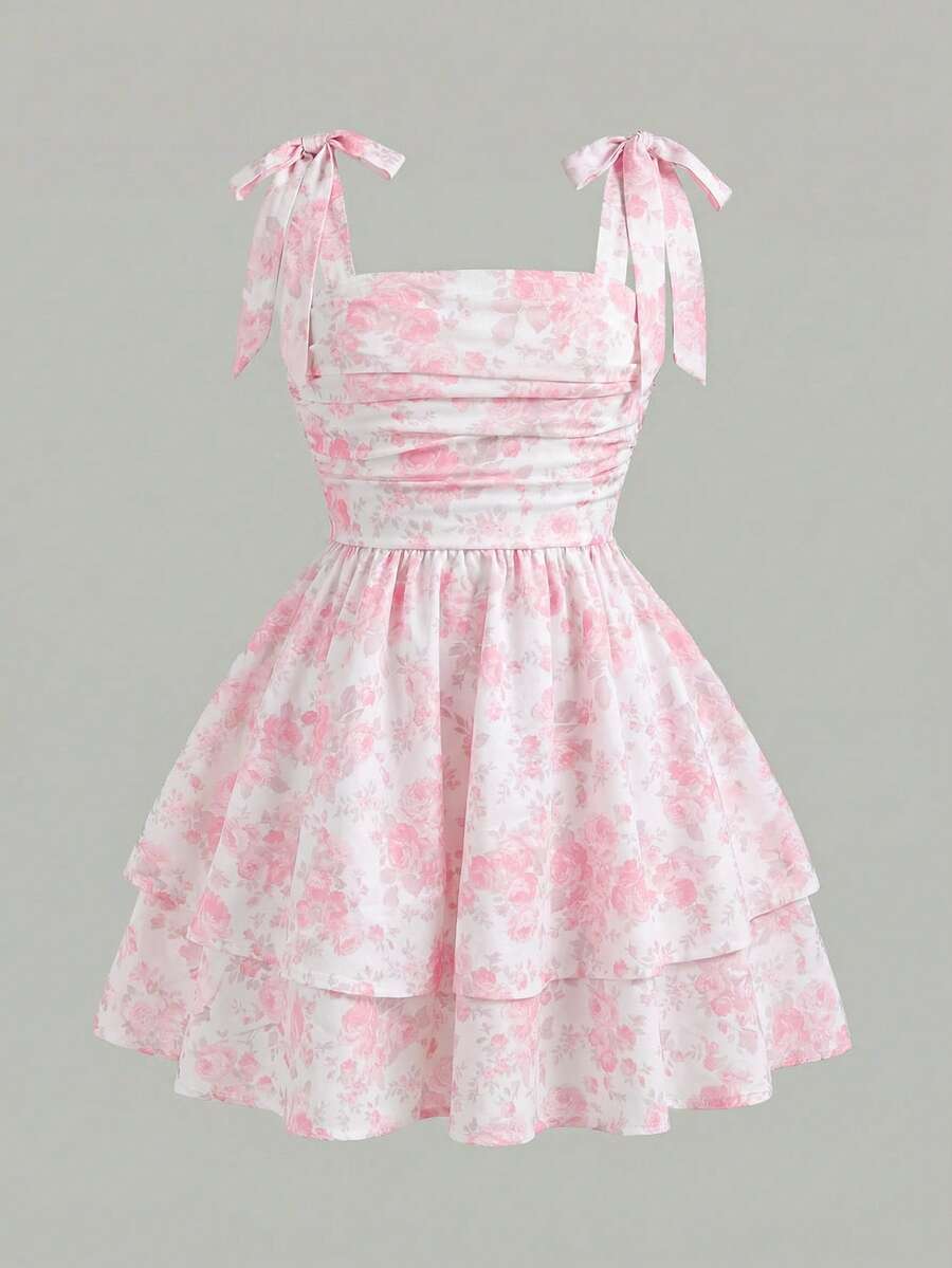 Black and white polka dot cami dress for tween girls featuring sleeveless straps, a shirred high waist, flared hem, and slim fit silhouette.