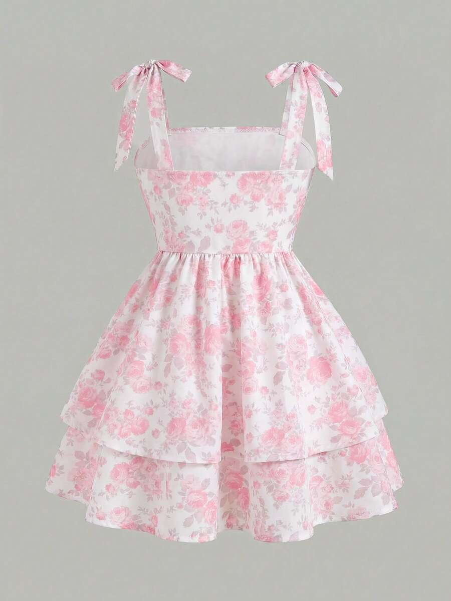 Black and white polka dot cami dress for tween girls featuring sleeveless straps, a shirred high waist, flared hem, and slim fit silhouette.