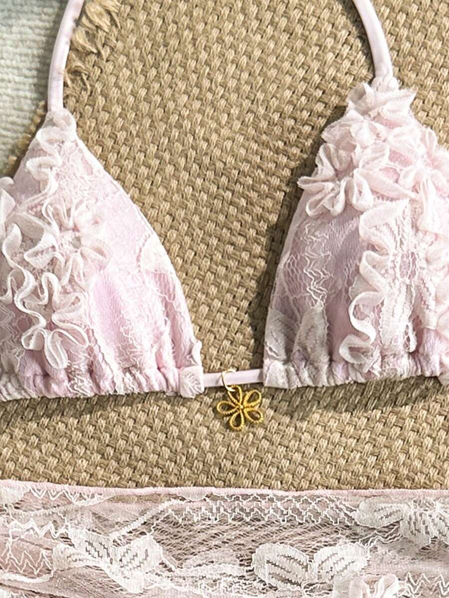Women's 3-piece blue tropical shell print bikini set featuring a halter bralette top, low-waist tie-side bottom, and a matching sheer mesh cover-up skirt.