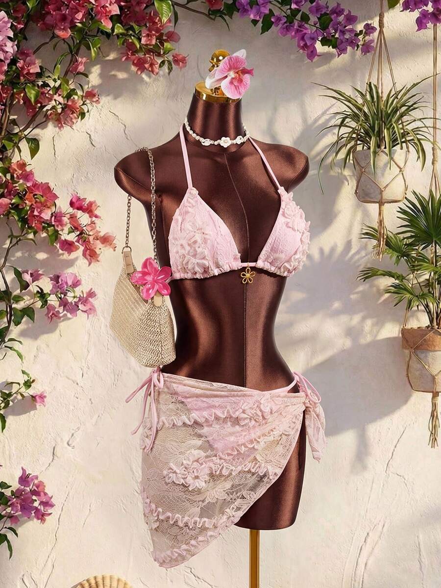 Women's 3-piece blue tropical shell print bikini set featuring a halter bralette top, low-waist tie-side bottom, and a matching sheer mesh cover-up skirt.