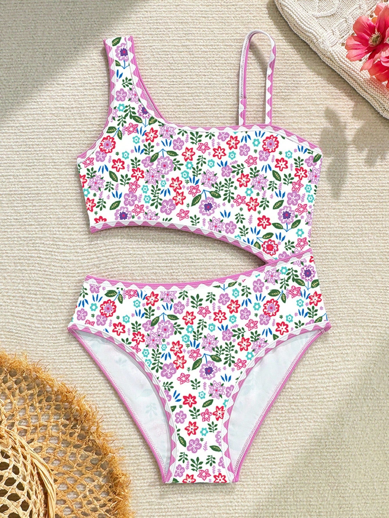 Tween girl one-piece swimsuit with floral plant print, asymmetrical neckline, cut-out detail, and fitted high-stretch design for beach and pool wear