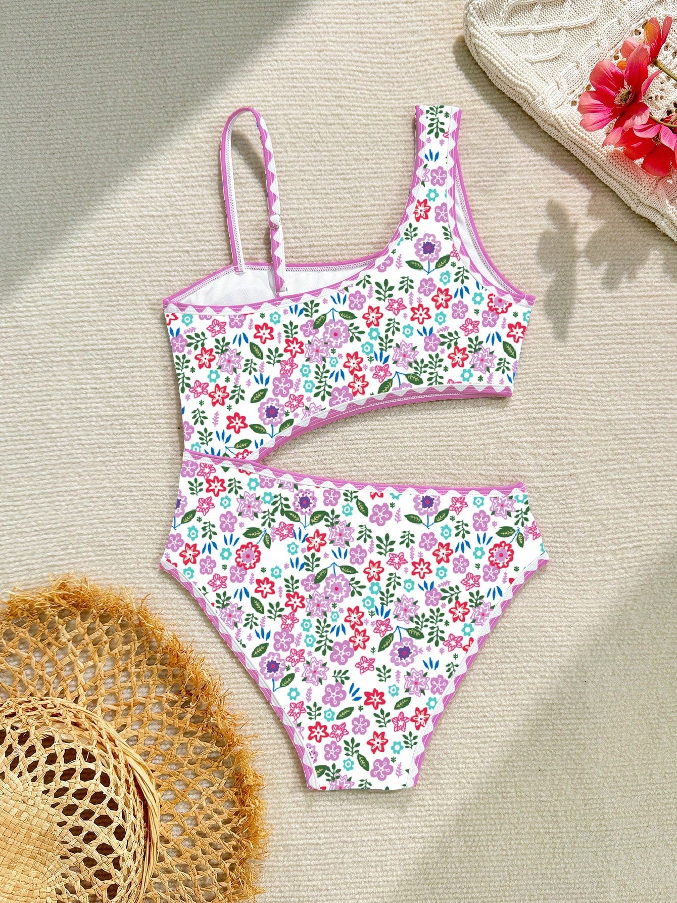 Tween girl one-piece swimsuit with floral plant print, asymmetrical neckline, cut-out detail, and fitted high-stretch design for beach and pool wear
