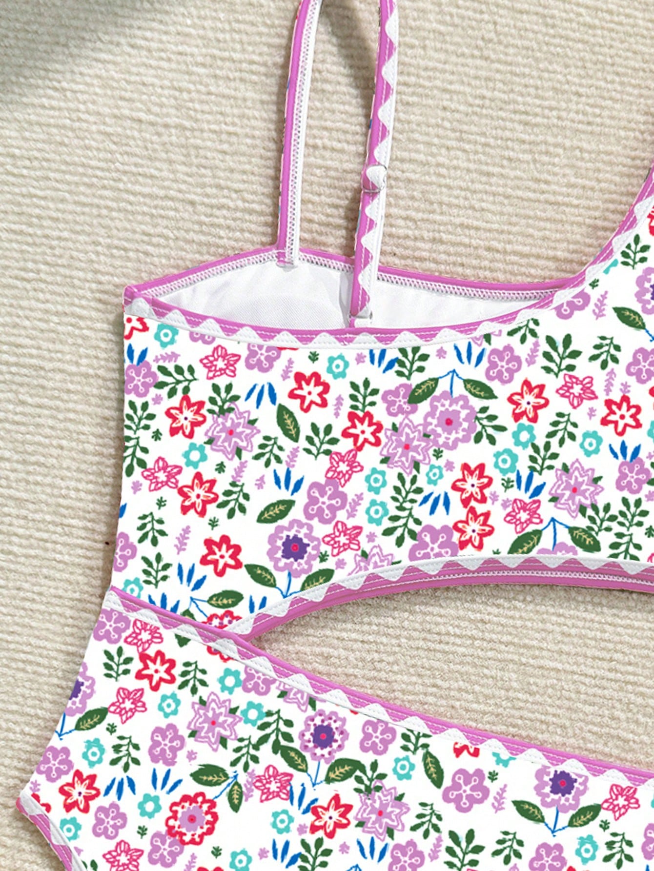 Tween girl one-piece swimsuit with floral plant print, asymmetrical neckline, cut-out detail, and fitted high-stretch design for beach and pool wear