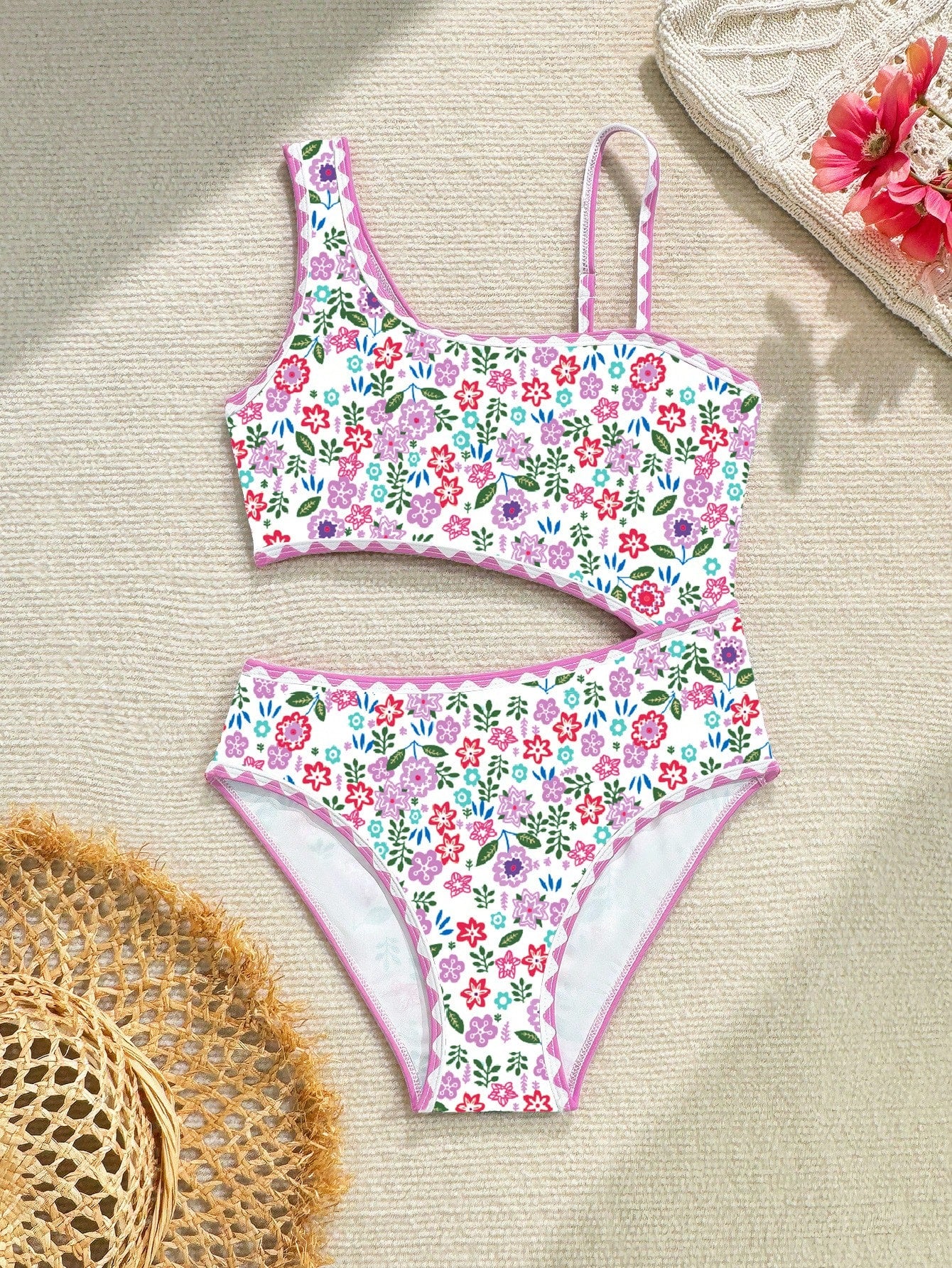 Tween girl one-piece swimsuit with floral plant print, asymmetrical neckline, cut-out detail, and fitted high-stretch design for beach and pool wear