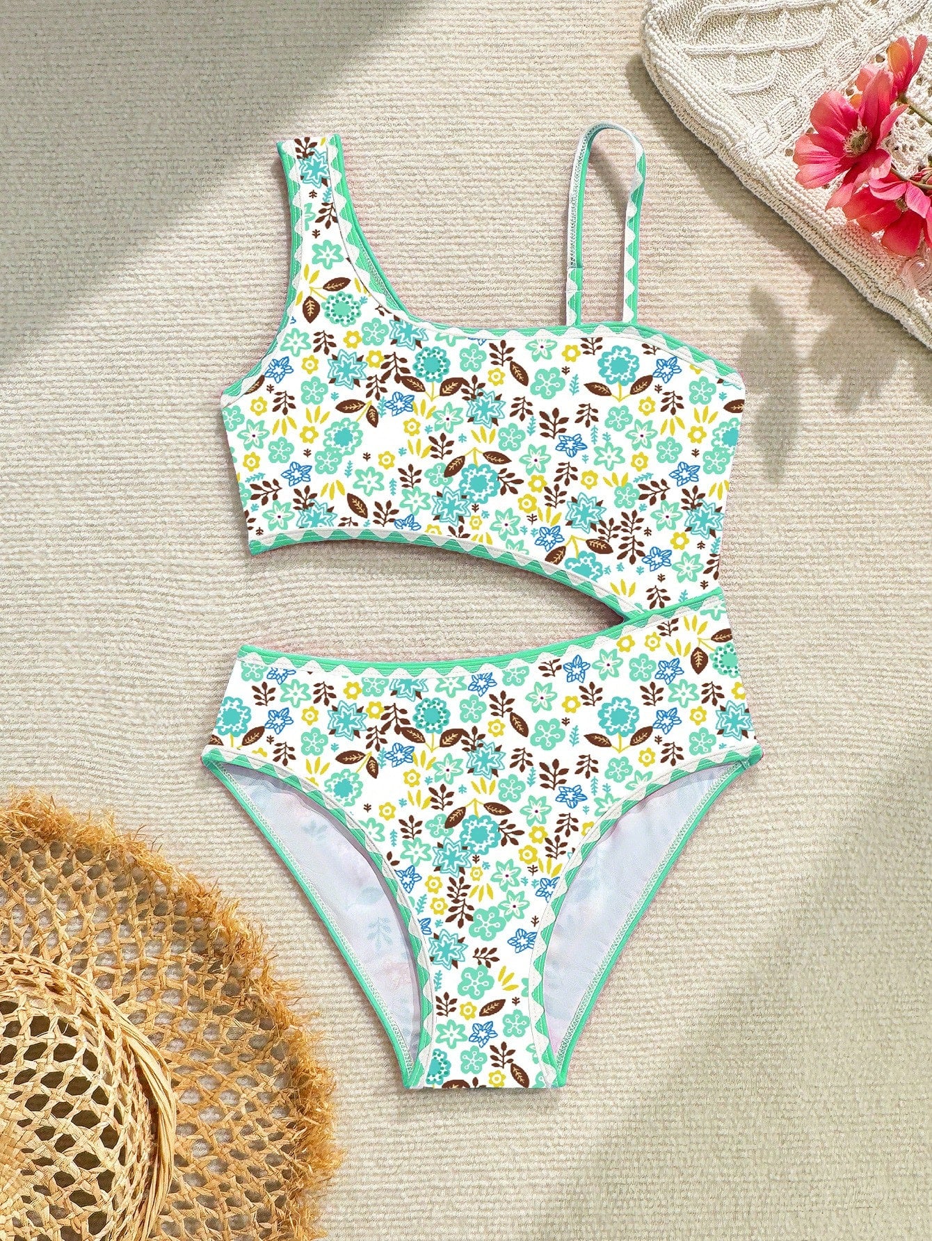 Tween girl one-piece swimsuit with floral plant print, asymmetrical neckline, cut-out detail, and fitted high-stretch design for beach and pool wear
