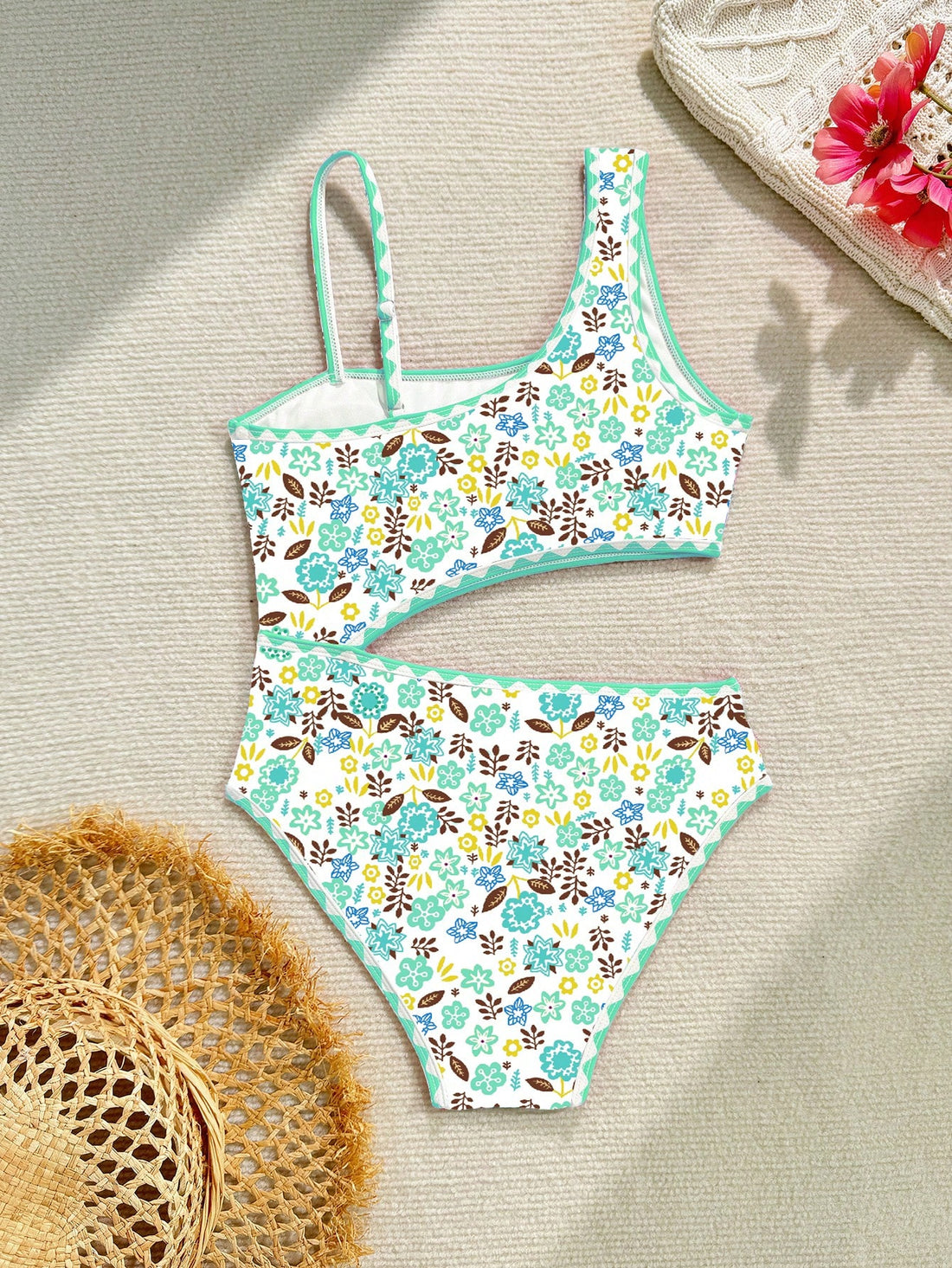 Tween girl one-piece swimsuit with floral plant print, asymmetrical neckline, cut-out detail, and fitted high-stretch design for beach and pool wear