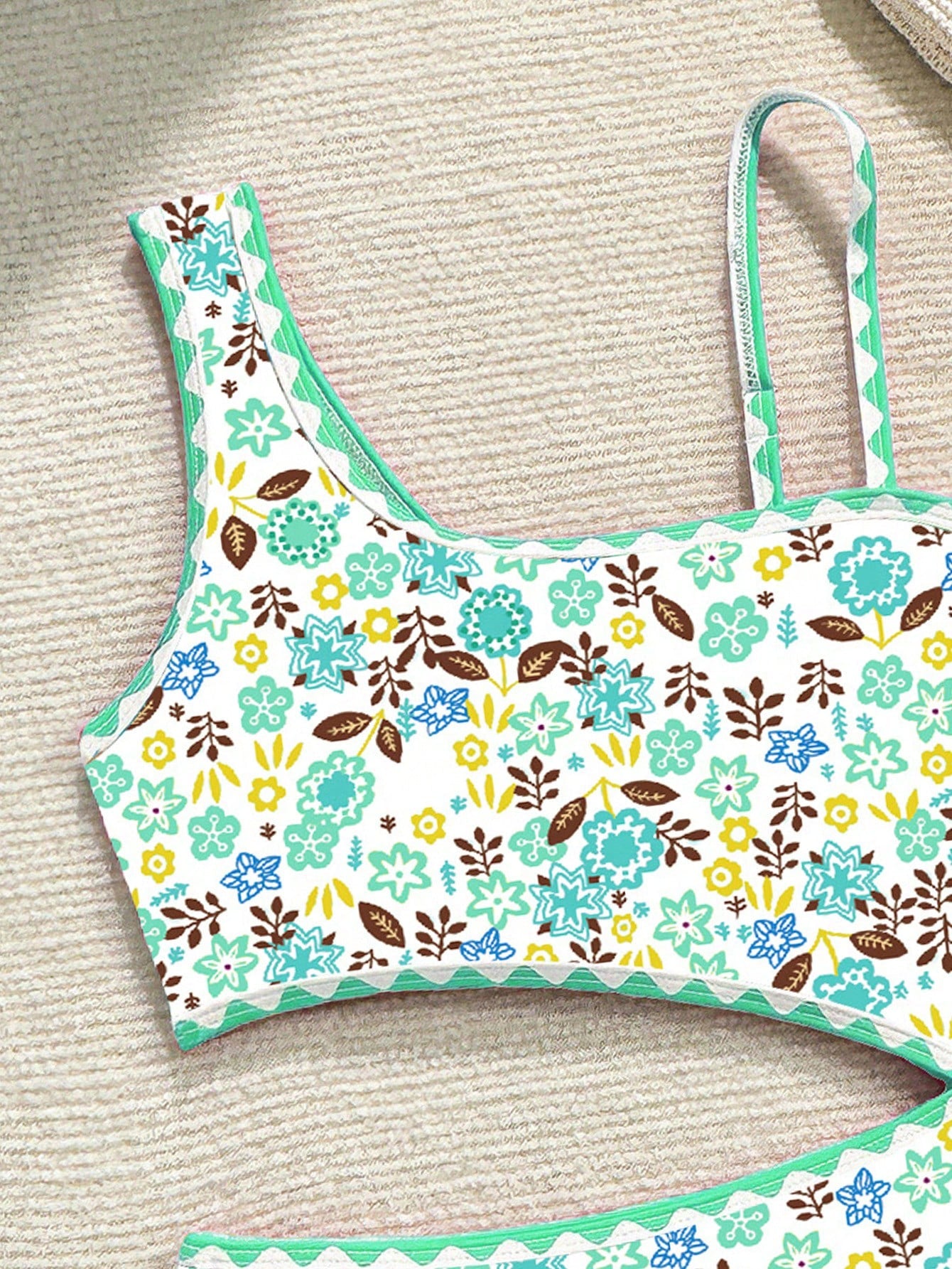 Tween girl one-piece swimsuit with floral plant print, asymmetrical neckline, cut-out detail, and fitted high-stretch design for beach and pool wear