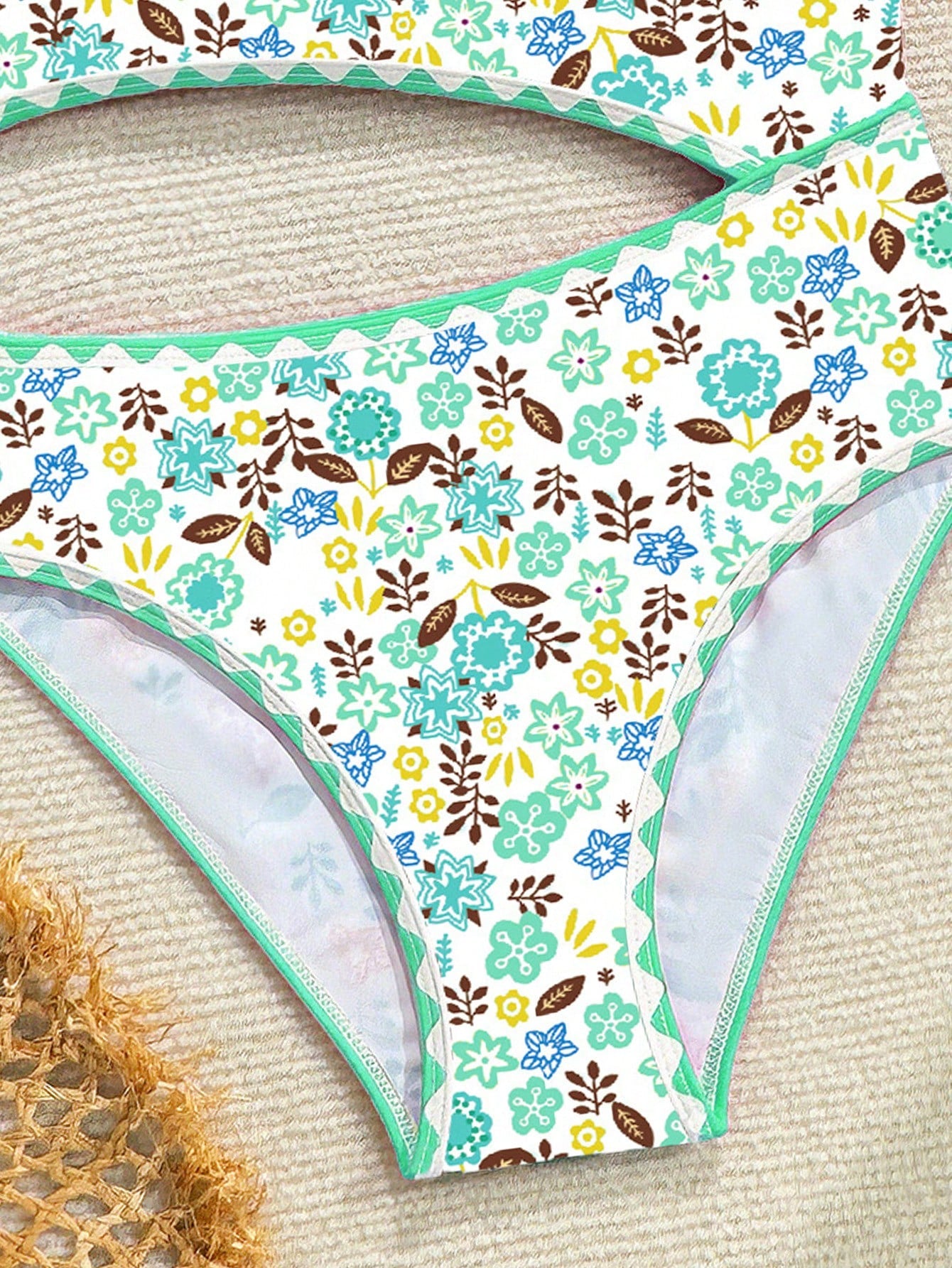 Tween girl one-piece swimsuit with floral plant print, asymmetrical neckline, cut-out detail, and fitted high-stretch design for beach and pool wear