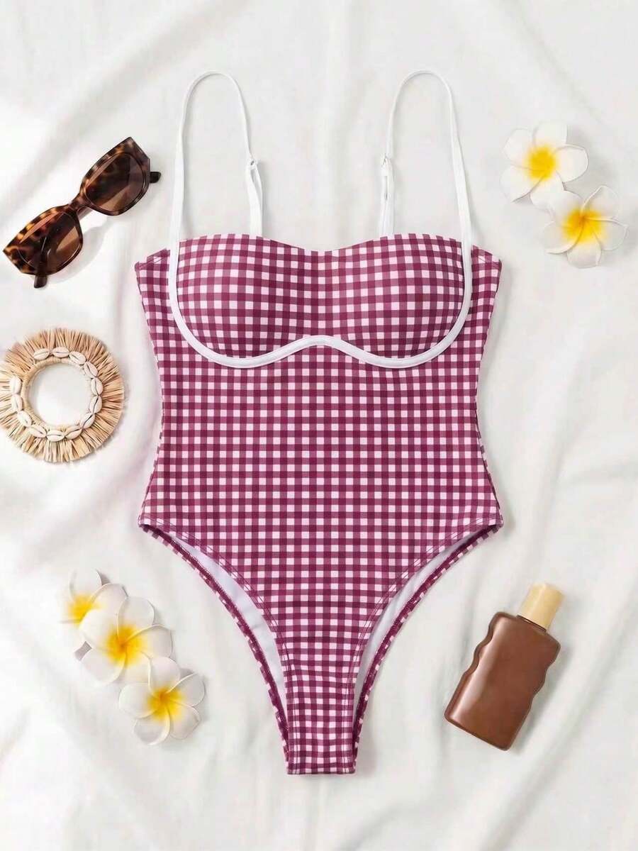 Black colorblock women's one-piece swimsuit with spaghetti straps and high stretch fabric.