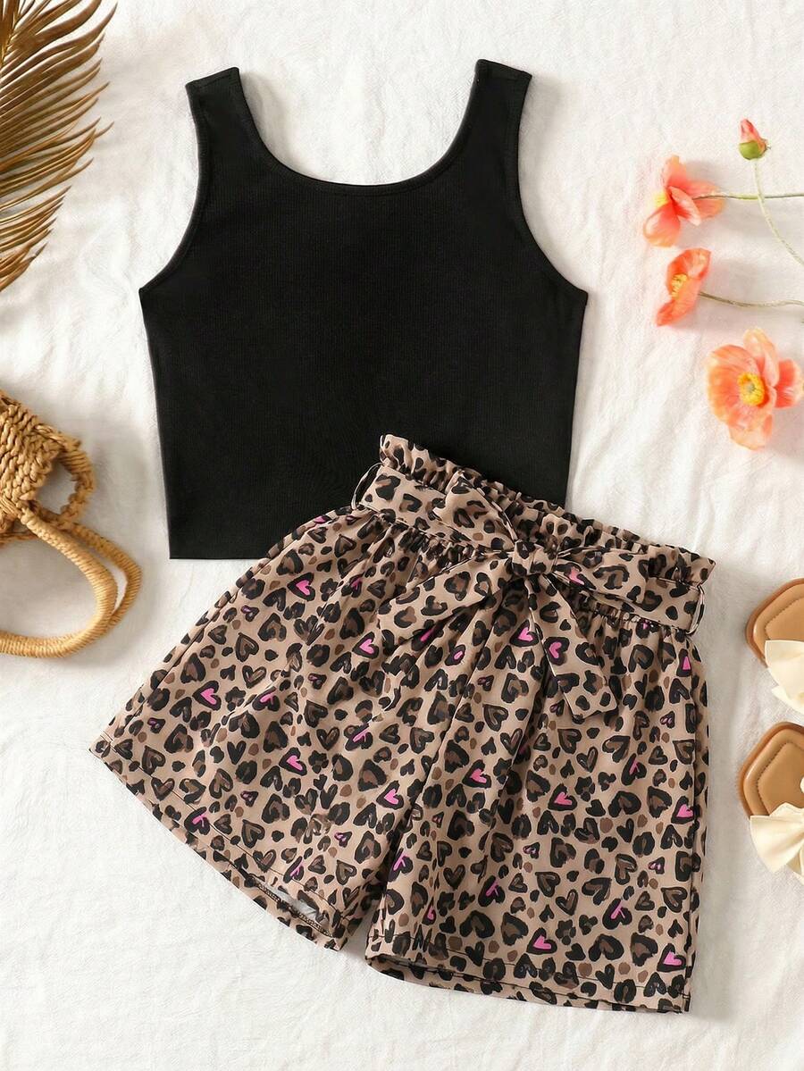 Tween girl wearing a casual 2-piece set featuring a black rib-knit scoop neck tank top and leopard print paperbag waist shorts with a matching belt.