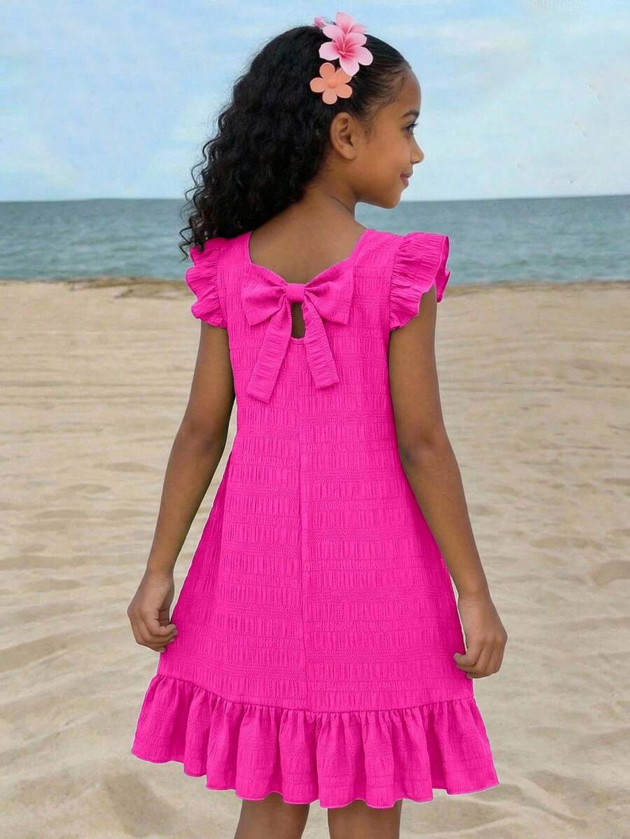 Tween girls apricot vacation midi dress featuring a round neck, cut out details, ruffle flounce accents, and geometric pattern.