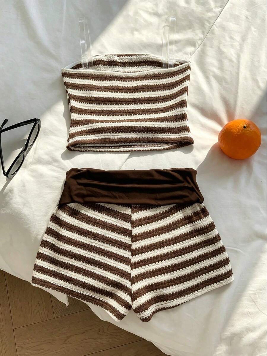 Tween girls black and white striped two-piece set featuring a spaghetti strap micro crop tank top with lettuce trim and ruffle hem paired with matching slim fit shorts.