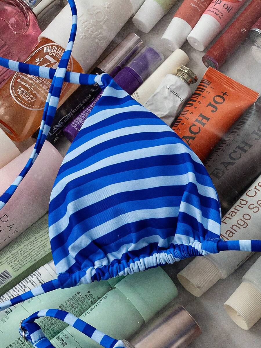 Women's printed halter neck tie two-piece swimwear featuring a wireless triangle top with removable padding and high-waist high-cut bikini bottoms.