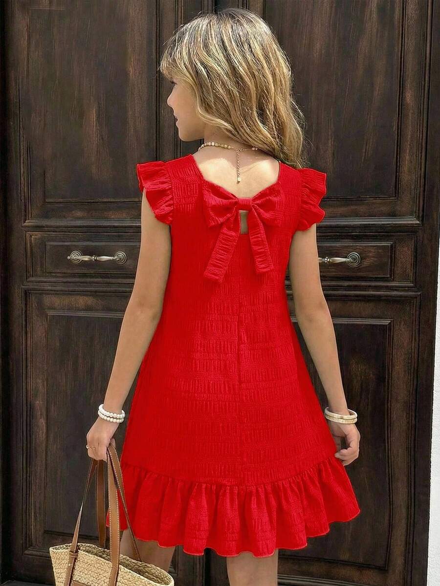 Tween girls apricot vacation midi dress featuring a round neck, cut out details, ruffle flounce accents, and geometric pattern.