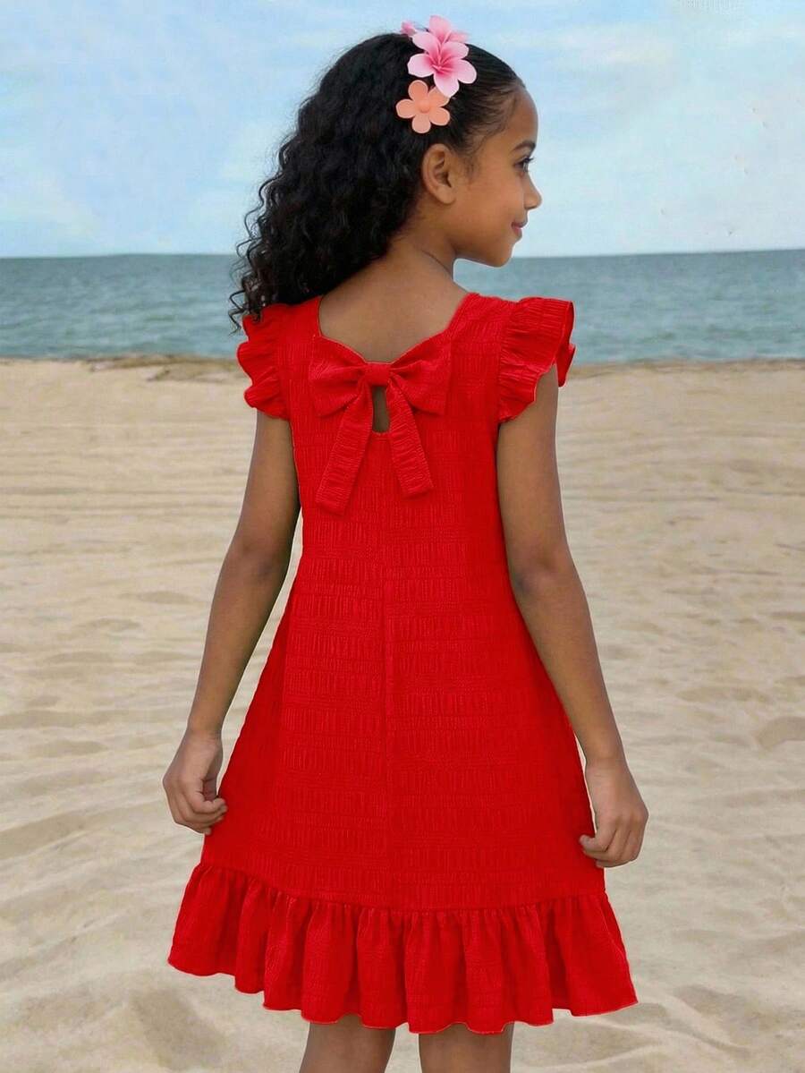Tween girls apricot vacation midi dress featuring a round neck, cut out details, ruffle flounce accents, and geometric pattern.