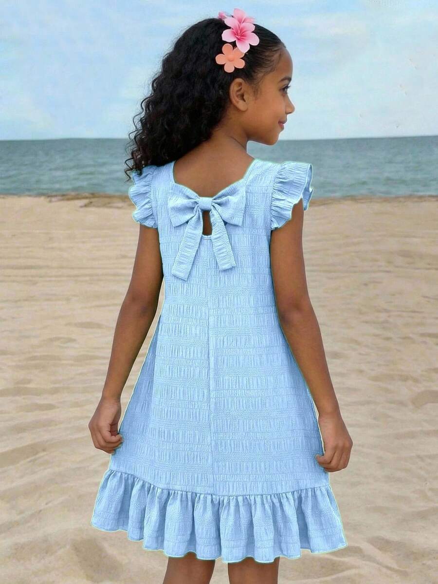 Tween girls apricot vacation midi dress featuring a round neck, cut out details, ruffle flounce accents, and geometric pattern.