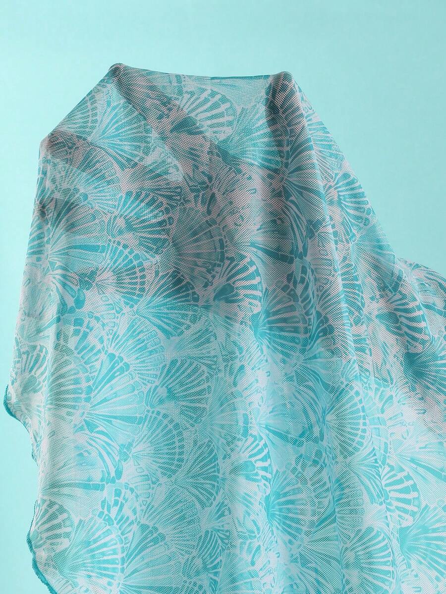 Women's 3-piece blue tropical shell print bikini set featuring a halter bralette top, low-waist tie-side bottom, and a matching sheer mesh cover-up skirt.