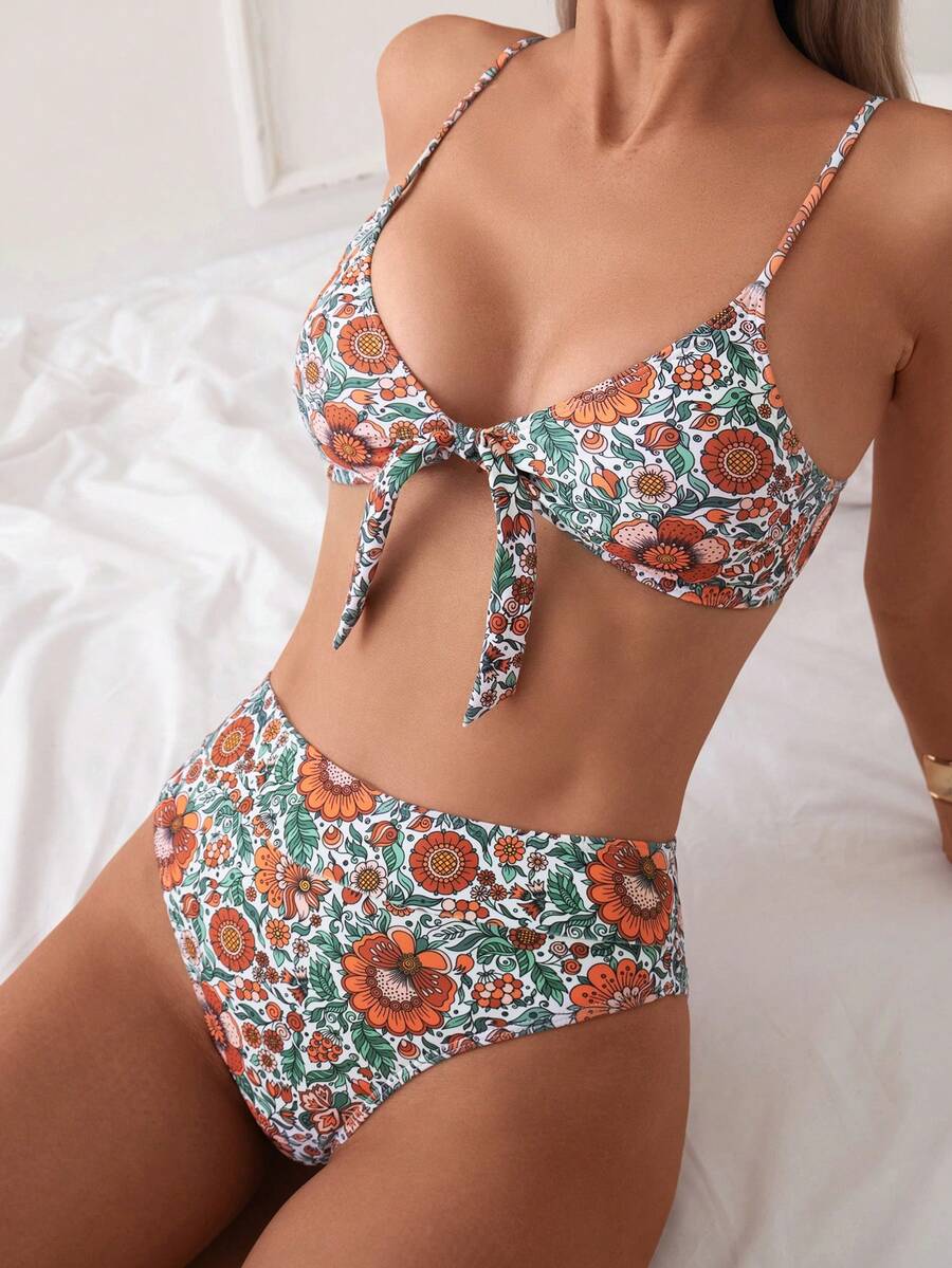Women's black 2-piece high waist bikini swimsuit set featuring spaghetti straps, criss-cross knot details, wireless bra with removable padding, and high-stretch fabric.
