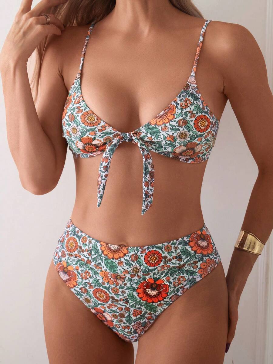 Women's black 2-piece high waist bikini swimsuit set featuring spaghetti straps, criss-cross knot details, wireless bra with removable padding, and high-stretch fabric.