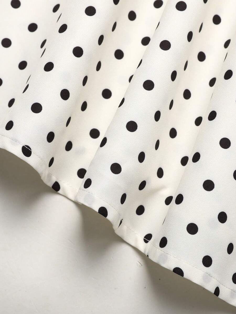 Tween girls apricot polka dot long cami dress with shoulder straps, high waist, and flared A-line skirt.