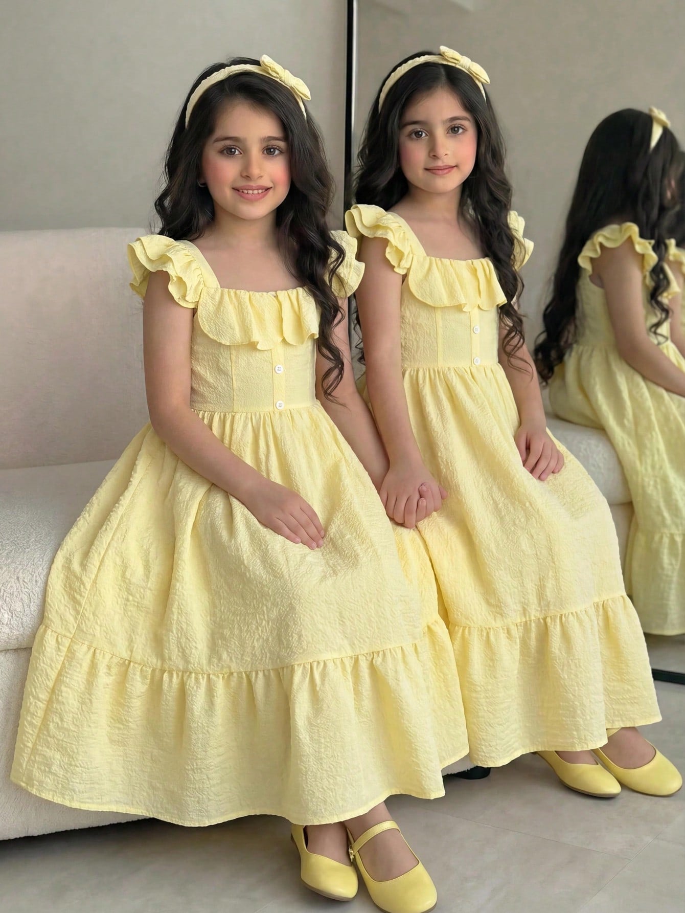 Tween girl multicolor floral vacation dress with square neck, ruffle details, shirred bodice, sleeveless A-line shape, high waist, and flounce hem.