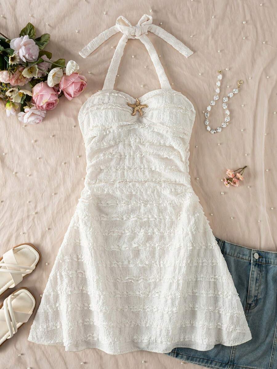 Apricot tween girls sleeveless halter cami dress with appliques, bow front, zipper detail, high waist, flared hem, and short slim fit design.