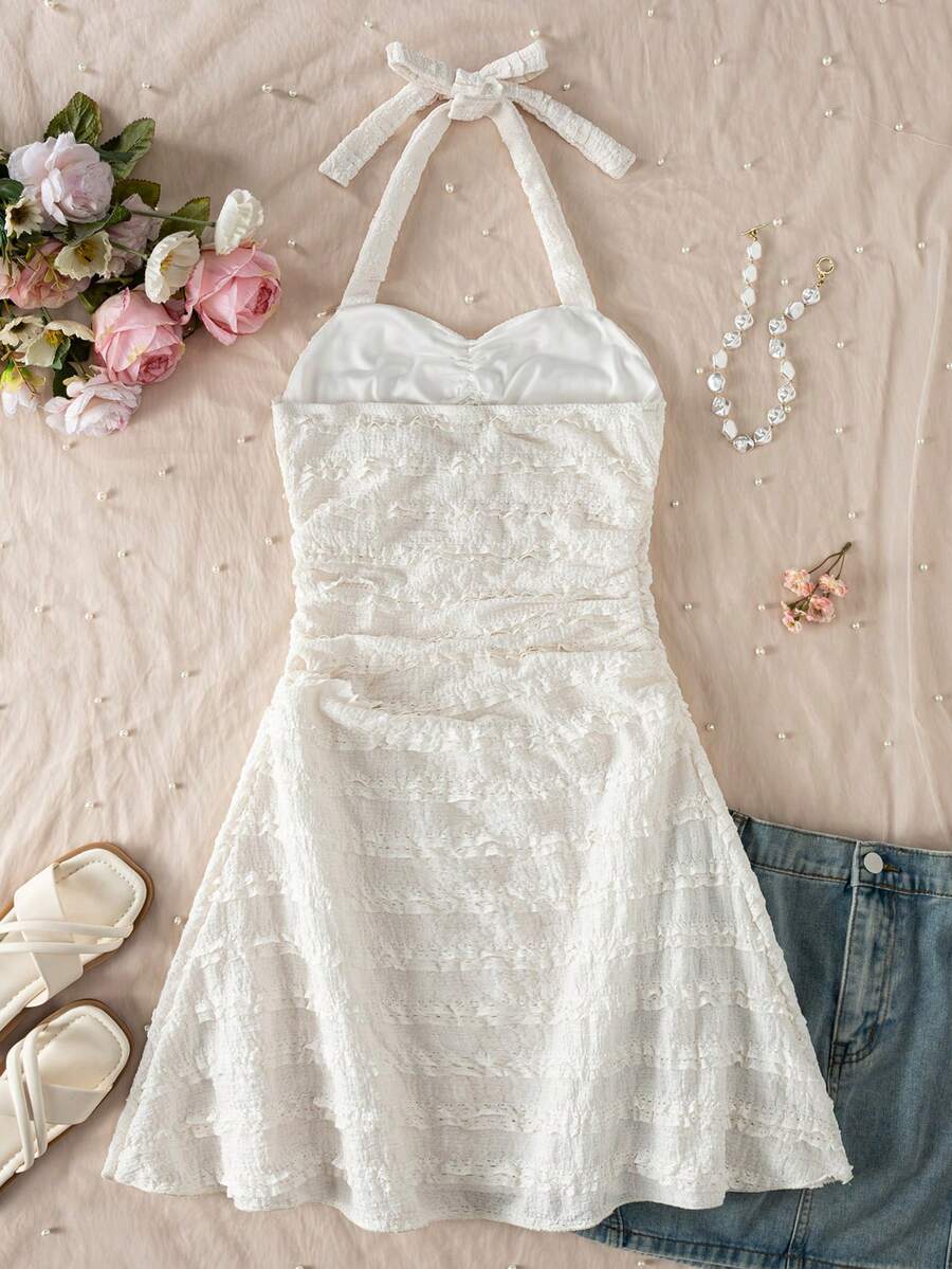 Apricot tween girls sleeveless halter cami dress with appliques, bow front, zipper detail, high waist, flared hem, and short slim fit design.